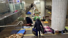 A woman walks through the Oleksiivska station in Kharkiv, Ukraine. Thousands of residents have been sheltering in the city's subway stations, but the mayor says it's safe to emerge now that Russian forces are retreating.