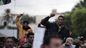 Libyan  protesters shout anti-Gadhafi slogans during a demonstration in the eastern  Libyan town of Derna on Wednesday.