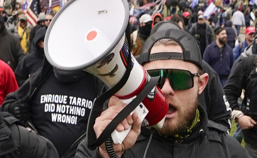 Proud Boys walk toward the U.S. Capitol in Washington in support of President Donald Trump on Jan. 6, 2021. A federal judge has refused to dismiss an indictment charging four alleged leaders of the group with conspiring to attack the Capitol.