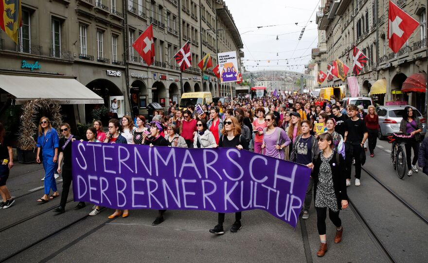 People took to the streets Friday in the Swiss capital, Bern, during a nationwide strike for wage parity for women.
