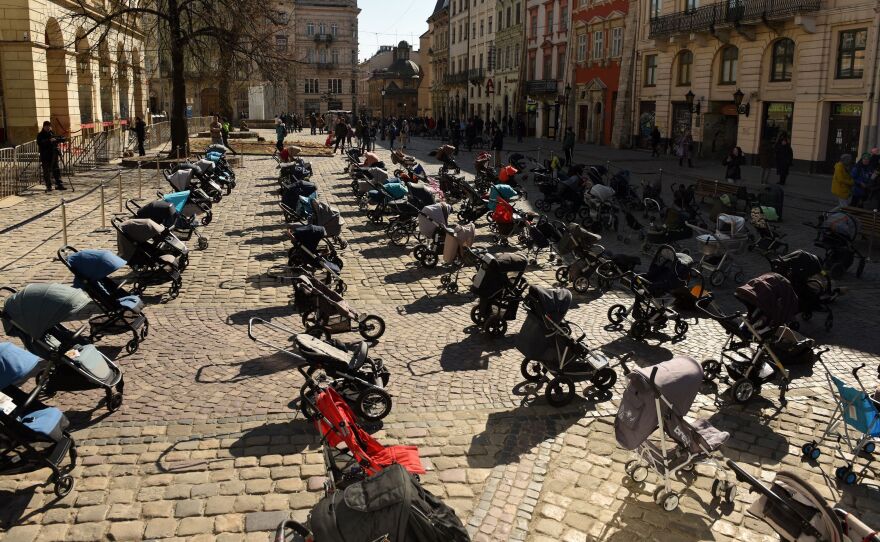 In a picture taken on March 18, 2022, 109 empty strollers are seen arrayed outside the Lviv City Council, highlighting the number of children killed in the ongoing Russian invasion of Ukraine.