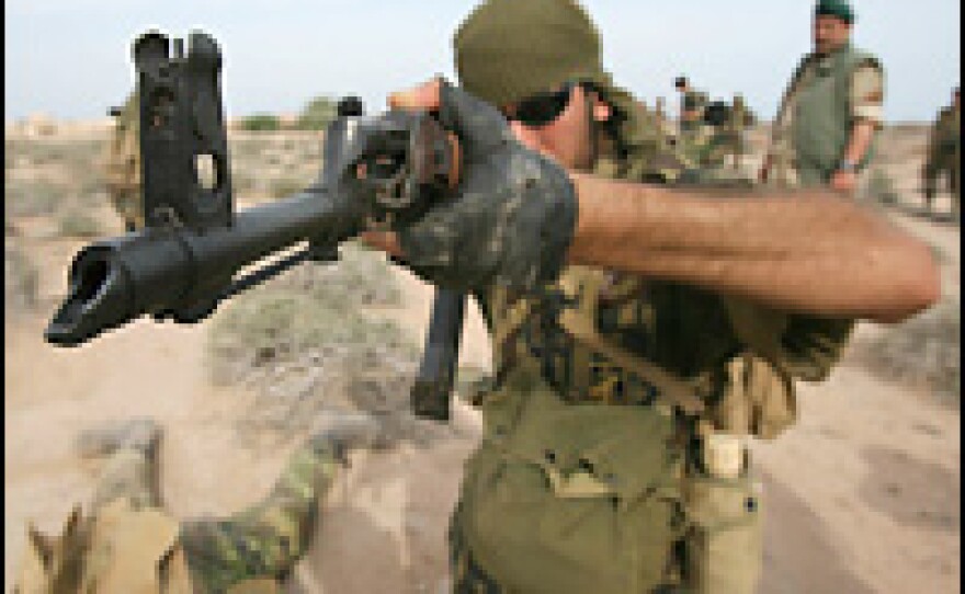 Iran's elite Revolutionary Guard special forces participate in military training near the Gulf in April 2006.