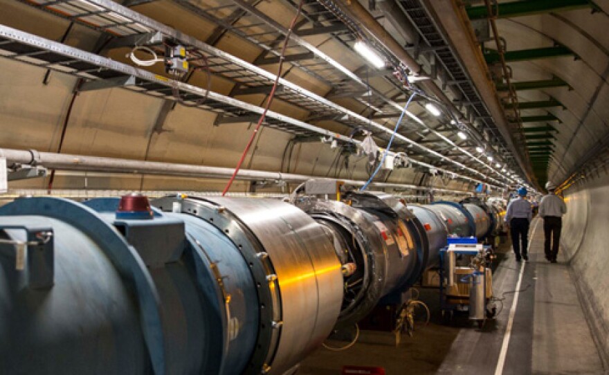 Professor Andy Lankford and Mario Livio walking in the LHC tunnel. The Large Hadron Collider (LHC) is the world's largest and most powerful particle accelerator.