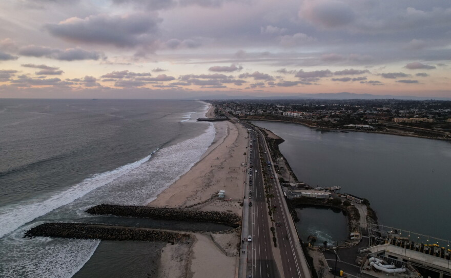 A drone view shows the Carlsbad desalination plant's intake lagoon on the right and the discharge canal on the left, Tuesday, Dec. 2, 2025, in Carlsbad, Calif.