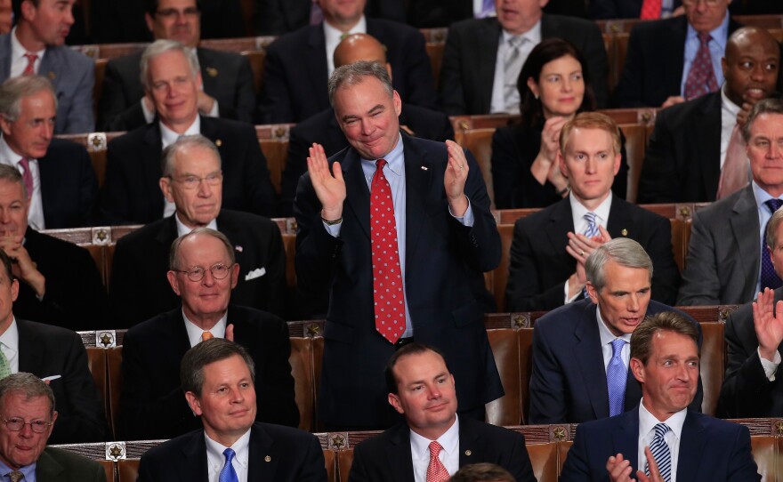 Sen. Tim Kaine, D-Va., applauds during the president's State of the Union address. Not every member of Congress was so moved.