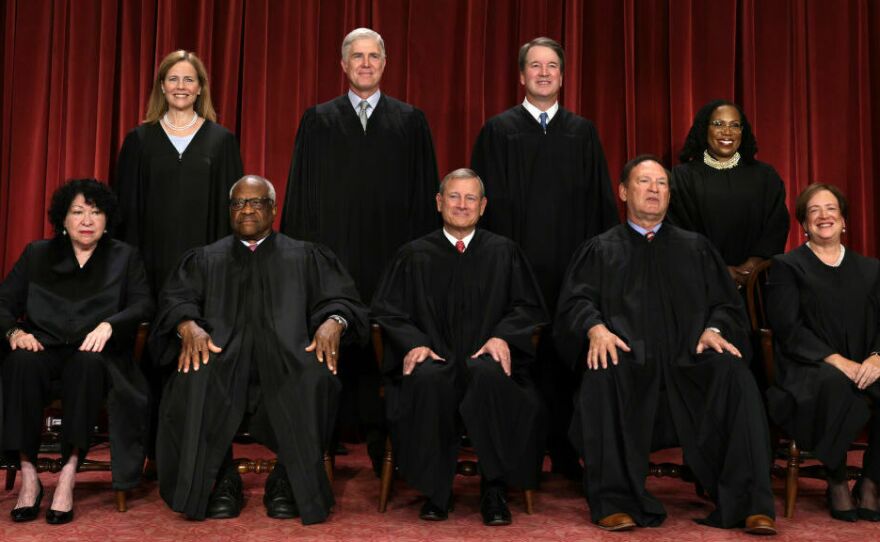 United States Supreme Court justices are pictured in October 2022: Sonia Sotomayor (front row from left), Clarence Thomas, Chief Justice John Roberts, Samuel Alito, and Associate Justice Elena Kagan; Amy Coney Barrett (back row from left), Neil Gorsuch, Brett Kavanaugh and Ketanji Brown Jackson.