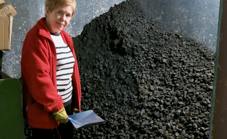 Arleta Wolek, a 73-year-old retired production line worker in Krakow, keeps her coal-burning stove in her basement. She feeds the 4-year-old stove from a nearby pile of coal that's almost as tall as she is.