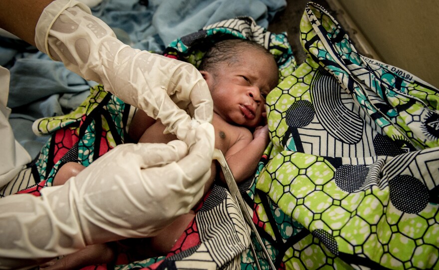A newborn has its umbilical cord cut after birth in a Nigerian hospital. In a contest last week, MBA students came up with plans to get moms and dads to use an antiseptic on the cord stump to ward off infection.