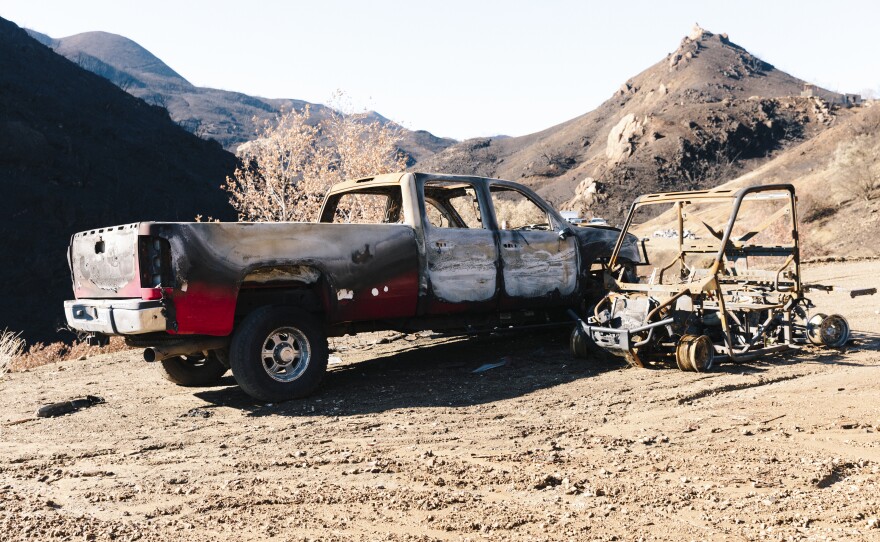 A few of the burned-out vehicles on Jones' property. The truck he used to escape during the fire is heavily blistered by fire, but still intact.
