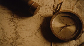 Promotional photo of a map and compass for the film, "Lewis & Clark: The Journey Of The Corps Of Discovery." This film tells the remarkable story of the United States' first exploration of the West, a voyage of danger and discovery from St. Louis to the headwaters of the Missouri River, over the Continental Divide to the Pacific. Hal Holbrook narrates.
