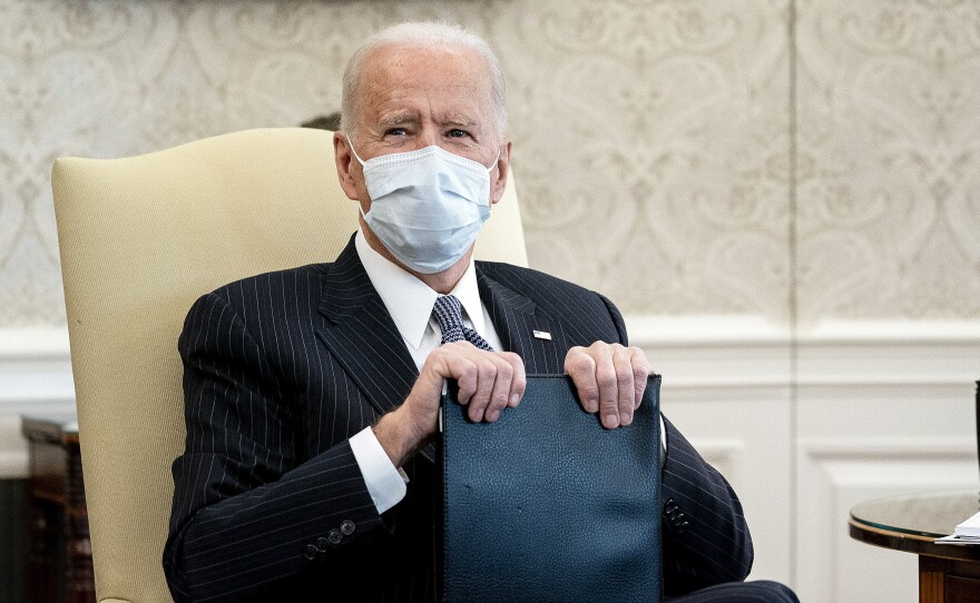 The White House says President Biden's COVID-19 economic rescue plan, including an expanded child tax credit, would help cut child poverty in half.