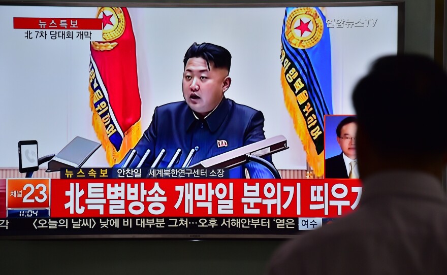 A man in South Korea watches a news broadcast Friday showing file footage of North Korean leader Kim Jong-Un. Speaking at a major gathering in North Korea, Kim declared "great success" in the country's recent nuclear test and a rocket launch.