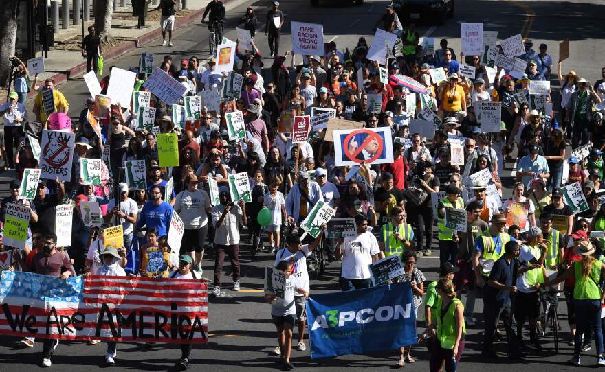People marching in the "#NoMuslimBanEver" rally in downtown Los Angeles on Sunday. Organized by the Council on American-Islamic Relations, the march was in response to President Trump's most recent travel ban, which has now been partially blocked by a federal judge in Hawaii.