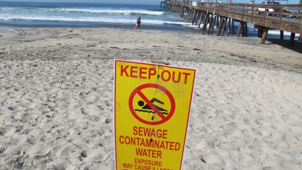 A sign warning people not to swim in Imperial Beach after 31 million gallons of sewage had spilled just south of the border in Playas de Tijuana, Jan. 20, 2011.