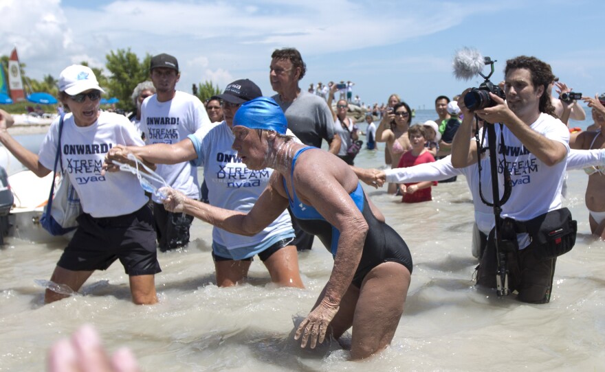 Diana Nyad struggles to come ashore in Key West on Sept. 2, 2013, after completing her swim from Cuba.