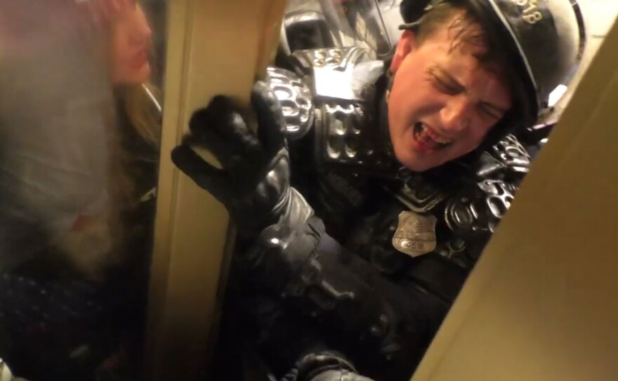 A screenshot of a video showing D.C. Metropolitan police officer Daniel Hodges being attacked at the Capitol on Jan. 6, 2021.