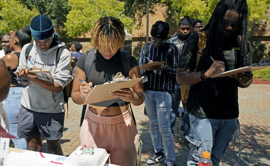 Jackson State University students sign up to vote in Jackson, Miss., on National Voter Registration Day in 2023.