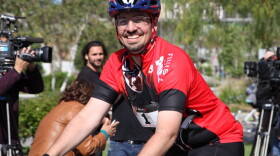 Damian Kevitt rolls through the finish line a year after a horrific hit-and-run crash that resulted in him losing a leg.