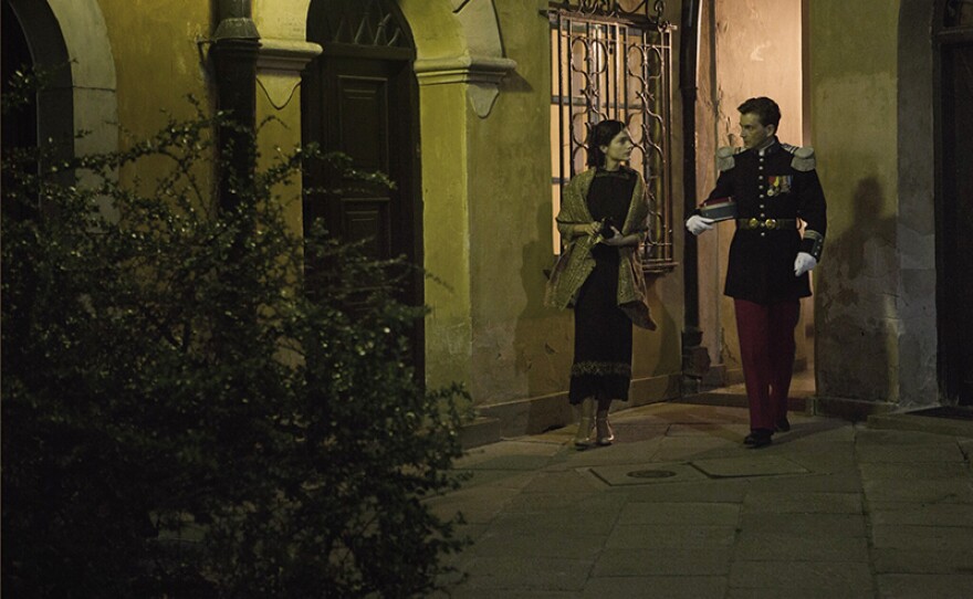 Mercier (DAVID TENNANT) walking Anna (JANET MONTGOMERY) home from the embassy dinner.