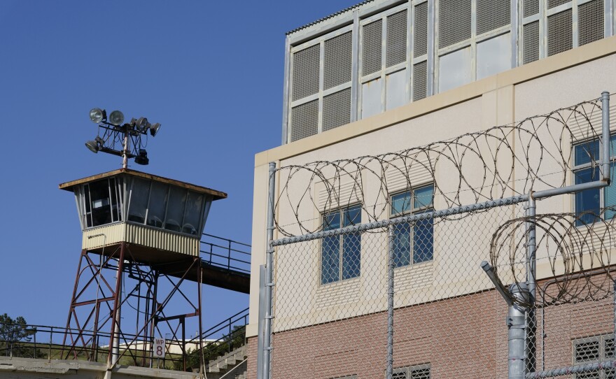 Barbed wire and a guard tower is seen at San Quentin State Prison on April 12, 2022, in San Quentin, Calif. California could reinstate voting rights to felons while they are in prison in a major expansion of suffrage for incarcerated people if a bill currently before the state legislature passes despite an uphill battle.