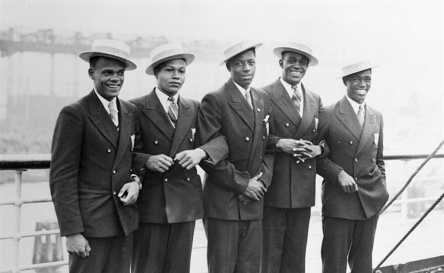 July 31, 1936, Hamburg, Germany. Athletes on USA's Olympic team are pictured aboard the S.S. Manhattan upon arrival at Hamburg. Left to right are Jimmy LuValle, Archie Williams, John Woodruff, Benjamin Johnson and Matthew Robinson.