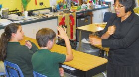 Teacher Kathy Henley with her students at Fort Benning, Georgia in 2010.