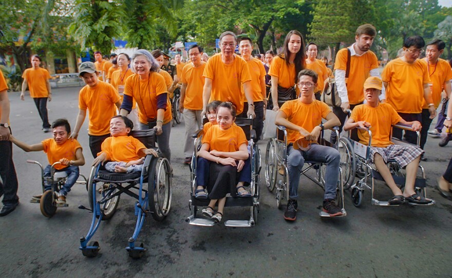 Tran To Nga marches with Agent Orange victims, families and supporters in Ho Chi Minh City, Vietnam.