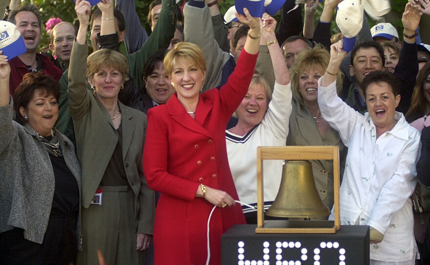 Fiorina rings a bell to virtually open the New York Stock Exchange from HP's headquarters in Palo Alto, Calif., on May 6, 2002. HP changed its ticker symbol from HWP to HPQ to reflect its $19 billion acquisition of Compaq Computer Corp.