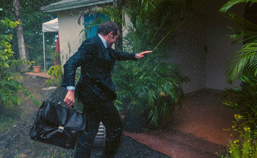 DI Richard Poole (Ben Miller) gets caught in the rain as Hurricane Irma approaches Saint Marie.