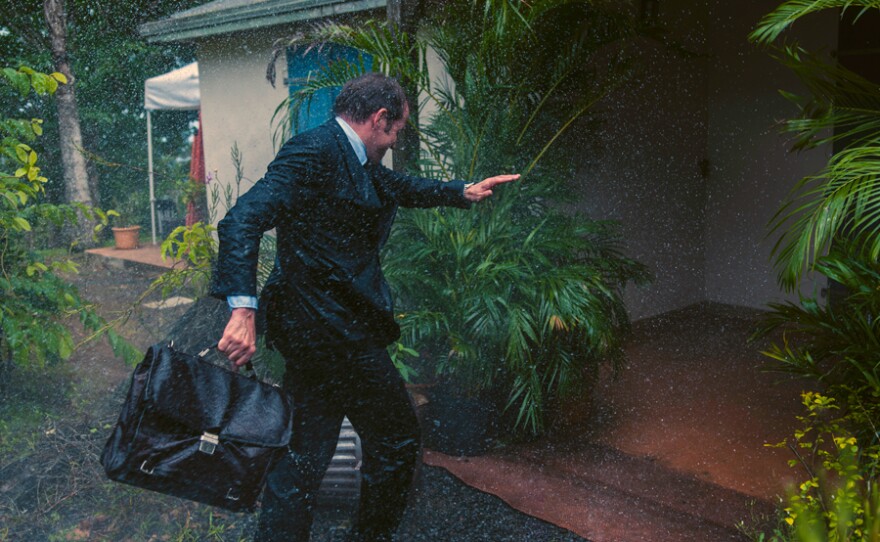 DI Richard Poole (Ben Miller) gets caught in the rain as Hurricane Irma approaches Saint Marie. 