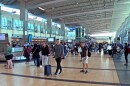 Travelers waiting to claim their baggage inside Terminal 2 of the San Diego International Airport on May 30, 2022.