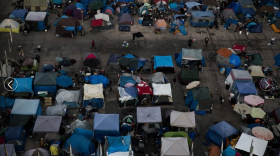 A large homeless encampment is formed at the Santa Ana Civic Center on Oct. 11, 2017 in Santa Ana, Calif.