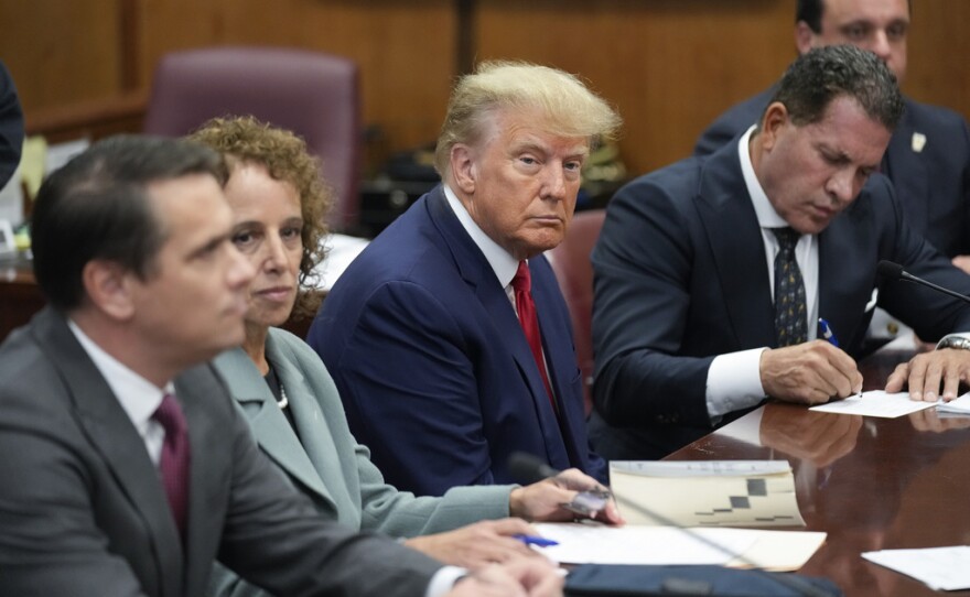 Former President Donald Trump sits at the defense table with his defense team in a Manhattan court, Tuesday, April 4, 2023, in New York. Trump is set to appear in a New York City courtroom on charges related to falsifying business records in a hush money investigation, the first president ever to be charged with a crime. 