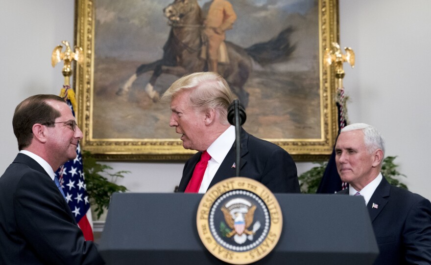 President Trump shakes hands with Health and Human Services Secretary Alex Azar  after he is sworn in by Vice President Pence on Jan. 29. Major reproductive health organizations are voicing concerns about the Trump administration's new approach to federal family-planning grants, which may reduce the role of Planned Parenthood and place greater emphasis on "natural family planning."