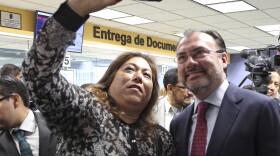Elisa Jimenez, director of the California Mental Health Connection, takes a selfie with Mexico's Secretary of Foreign Relations Luis Videgaray at the dedication of a mental health facility at the Consulate General of Mexico in Los Angeles Tuesday, Sept. 12, 2017. 