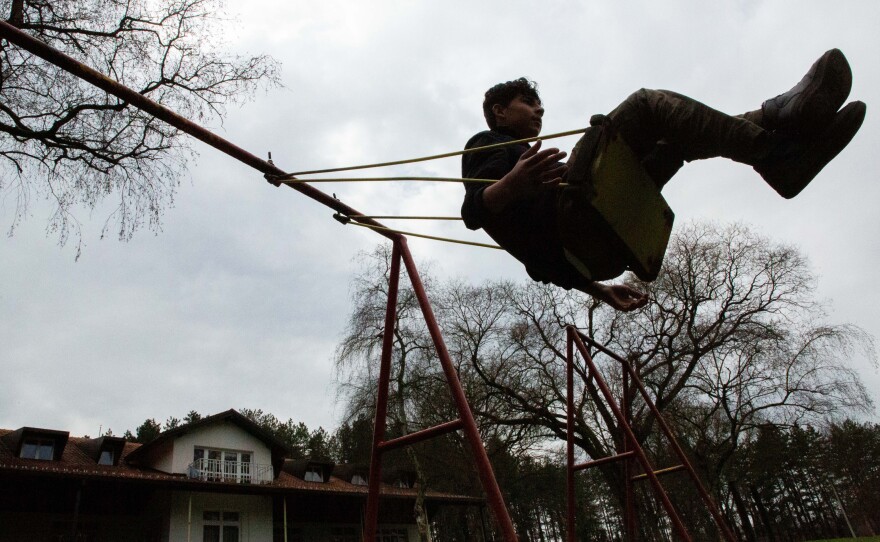 Mohammad Bilal, 17, from Afghanistan, plays on a swing at Bogovadja asylum center in central Serbia. He reached Serbia alone after smugglers in Iran put him in the trunk of a car alongside four other children with no water and amid scorching temperatures. "I thought that was my last day on earth," he says.