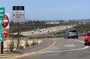 Vehicles drive onto State Route 52 west at Santo Road in San Diego on April 28, 2026.