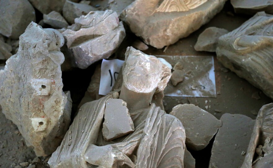 Pieces of beheaded and mutilated sculptures lie on the ground at the museum of the ancient city of Palmyra, Syria, on Thursday. Syrian troops with Russian support recaptured Palmyra last week, after a fierce offensive to retake the city from jihadists who view the UNESCO-listed site's ruins as idolatrous.