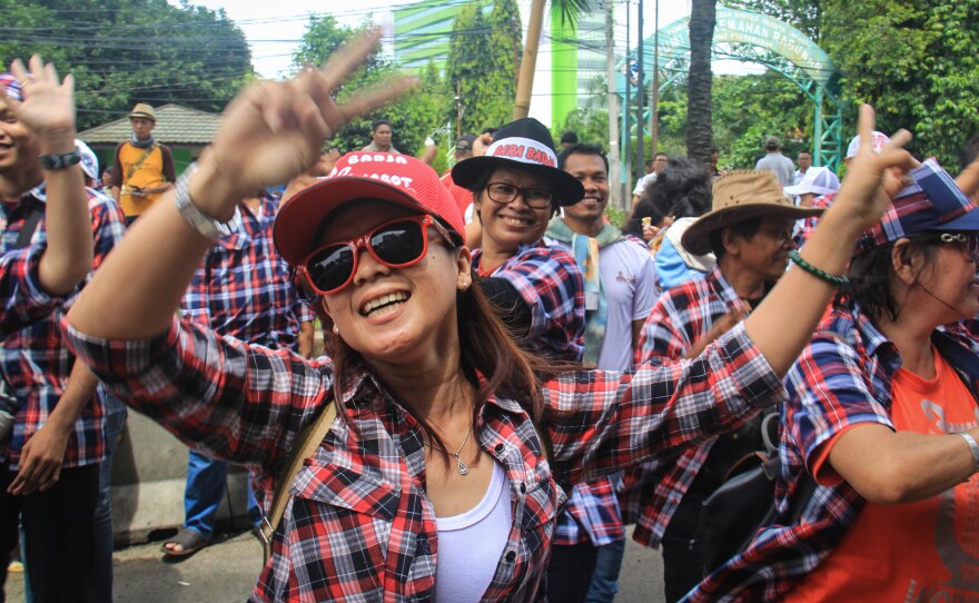 Demonstrators dance and rally in support of Jakarta Gov. Basuki Tjahaja Purnama outside the courthouse where he is on trial for blasphemy. The case has raised concerns about religious and ethnic tolerance in a country that claims to be one of the Islamic world's most moderate.