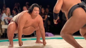 Sumo wrestlers, Hiroki Sumi and Byambajav Ulambayar square off in match.