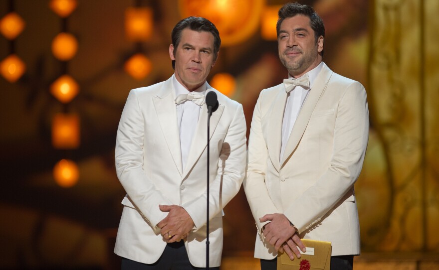 Presenters Josh Brolin and Javier Bardem in spiffy white tux jackets.