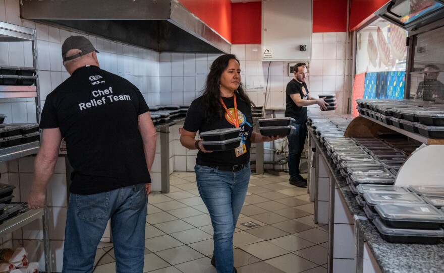 Zomi Frankcom works with colleagues and volunteers to unload and arrange for distribution lunch casseroles <a href="https://www.npr.org/2022/04/12/1091916421/russia-ukraine-war-refugees-romania">at Gara de Nord railway station in Bucharest</a> on April 6, 2022. The Australian aid worker was among those killed by an Israeli strike in Gaza.