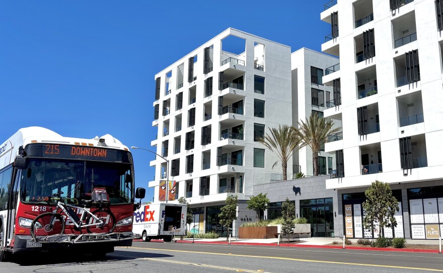 An MTS bus headed for downtown passes the Nash apartment building in North Park, July 25, 2025.
