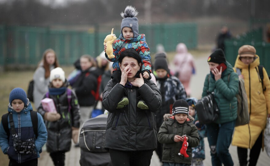 Women and children from Ukraine arrive at the border crossing in Medyka, Poland, on Saturday.