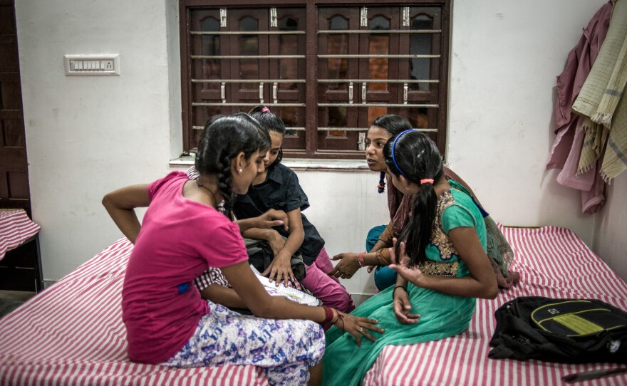 Bedtime at the Veerni Institute. Before turning in, the girls gossip about their day.