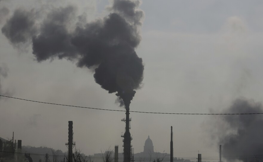 Smokestacks near an oil refinery are seen in front of the Utah State Capitol as an inversion settles over Salt Lake City in 2018. The air we breathe kills thousands of Americans every year.