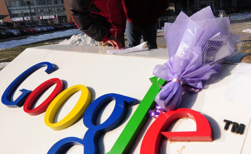 A bouquet of flowers lies upon the Google logo outside the company's Beijing headquarters.