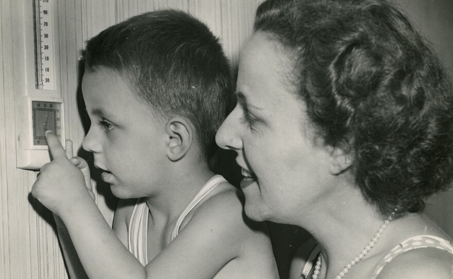 Andrew Nemethy and his mother check the thermostat at the Dover Sun House. Circa 1950.