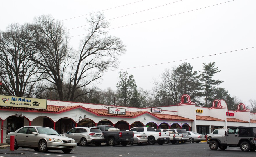 A strip mall sits just a block away from Central Avenue in East Charlotte, N.C.