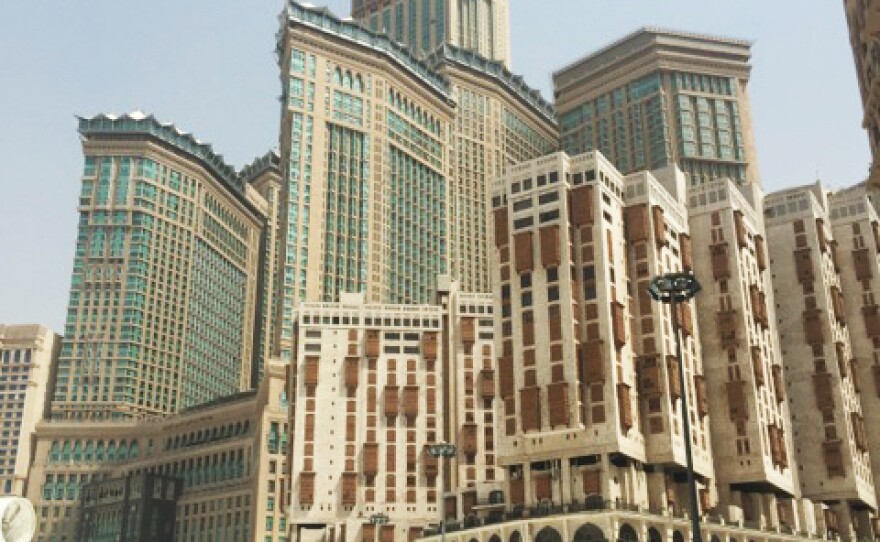 The Clock Tower Hotel overlooks passersby at the Grand Mosque.